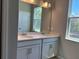 Bathroom features double sinks with a large mirror and neutral color scheme at 1173 Basalt Ln, Sanford, FL 32771