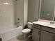Bathroom featuring white subway tile, a white toilet, and white vanity with sink at 1173 Basalt Ln, Sanford, FL 32771