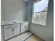 Bathroom with double vanity and quartz countertop at 1173 Basalt Ln, Sanford, FL 32771