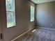 This bedroom features two large windows and a neutral color scheme at 1173 Basalt Ln, Sanford, FL 32771