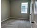 This bedroom features plush carpet, a window, and a neutral color scheme at 1173 Basalt Ln, Sanford, FL 32771