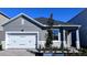 Single-story home with a two car garage, stone accents and a nicely landscaped front yard at 1173 Basalt Ln, Sanford, FL 32771