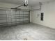 Spacious garage with an aluminum door and ample room for parking and storage at 1173 Basalt Ln, Sanford, FL 32771