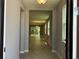 Inviting entryway with tile floors and a view into the living room with natural light at 1173 Basalt Ln, Sanford, FL 32771