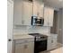 This kitchen features stainless steel appliances, stylish cabinets, and ample counter space at 1173 Basalt Ln, Sanford, FL 32771