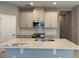 Spacious kitchen showcasing stainless steel appliances, quartz countertops and tiled backsplash at 1173 Basalt Ln, Sanford, FL 32771