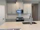 Well-equipped kitchen with stainless steel appliances, island, and plenty of storage at 1173 Basalt Ln, Sanford, FL 32771