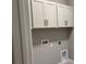 This laundry room features stylish cabinets at 1173 Basalt Ln, Sanford, FL 32771