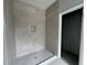 Large walk-in shower with neutral-toned tile at 1173 Basalt Ln, Sanford, FL 32771