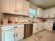 Bright kitchen with white cabinetry, stainless steel appliances, and a modern subway tile backsplash at 2227 Lovely Ln, Davenport, FL 33896