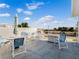 Private balcony with patio furniture, umbrella, and fire pit at 4260 S Atlantic Ave, Port Orange, FL 32127