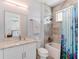 Bathroom with bathtub, toilet and vanity with granite countertop at 4260 S Atlantic Ave, Port Orange, FL 32127