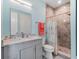 Bathroom with shower, toilet and granite countertop vanity at 4260 S Atlantic Ave, Port Orange, FL 32127