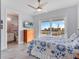 Bedroom with ocean view and dresser, featuring a blue and white comforter set at 4260 S Atlantic Ave, Port Orange, FL 32127