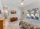 Spacious bedroom with tiled floor, sliding glass doors to the pool area, and dresser at 4260 S Atlantic Ave, Port Orange, FL 32127