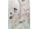 Walk-in shower with marble tile, pebble floor, and built-in seat at 4260 S Atlantic Ave, Port Orange, FL 32127