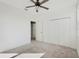 Neutral bedroom with a ceiling fan and double closet at 2563 Lamar Valley St, Apopka, FL 32703