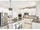 Stylish kitchen with stainless steel appliances, a center island, and white cabinets at 2563 Lamar Valley St, Apopka, FL 32703