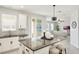 The kitchen island features granite countertops, white cabinets, and stainless steel appliances at 2563 Lamar Valley St, Apopka, FL 32703