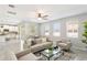 The living room features stainless steel ceiling fan and an open-concept layout with a kitchen view at 2563 Lamar Valley St, Apopka, FL 32703