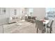 Neutral living room with large area rug and open floor plan at 2563 Lamar Valley St, Apopka, FL 32703