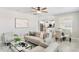 Spacious living room offers open concept layout, neutral furniture, and kitchen view at 2563 Lamar Valley St, Apopka, FL 32703