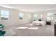 Expansive main bedroom with plush carpeting, multiple windows, and ensuite bathroom at 2563 Lamar Valley St, Apopka, FL 32703