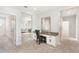 Built-in desk office space with granite countertop and views into living room at 2563 Lamar Valley St, Apopka, FL 32703