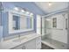 Contemporary bathroom featuring a white vanity, stand-up shower and a vessel sink at 2204 Clementine Trl, Clermont, FL 34714