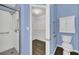 Stylish bathroom features a stand-up shower, toilet, and storage cabinet at 2204 Clementine Trl, Clermont, FL 34714