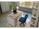 Home office features a large window, desk, rolling chair, and built-in shelves at 2204 Clementine Trl, Clermont, FL 34714