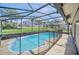 Enjoy the enclosed pool area with clear blue water for relaxation and leisure at 2204 Clementine Trl, Clermont, FL 34714