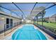 Cool off in this refreshing pool surrounded by a screened enclosure and a concrete deck at 2204 Clementine Trl, Clermont, FL 34714