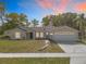 Charming single-story home featuring a well-manicured lawn, inviting curb appeal, and a convenient two-car garage at 790 Silhouette Ct, Longwood, FL 32750