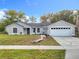 Charming single-story home featuring a well-manicured lawn, inviting curb appeal, and a convenient two-car garage at 790 Silhouette Ct, Longwood, FL 32750