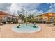 Charming splash pad area for , surrounded by colorful buildings and lounge chairs at 1055 Lake Berkley Dr, Kissimmee, FL 34746