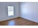 Bright bedroom with a window and sleek flooring create a peaceful atmosphere at 13882 Sw 56Th Ln, Ocala, FL 34482
