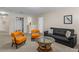 Upstairs living area with seating, coffee table, closet, and decorative artwork at 1473 Moon Valley Dr, Davenport, FL 33896