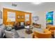 Living room area with sofas, chairs, and entertainment center at 1473 Moon Valley Dr, Davenport, FL 33896