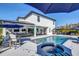 Aerial view of a home showcasing a pool with spa, outdoor kitchen, patio, and lush landscaping at 4001 Ainsley Ave, Orlando, FL 32833
