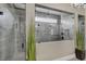 Modern bathroom features glass-enclosed shower with multiple shower heads at 4001 Ainsley Ave, Orlando, FL 32833