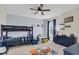 bedroom with a bunk bed, a baseball rug, and blue-themed decorations at 4001 Ainsley Ave, Orlando, FL 32833