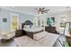 Spacious main bedroom features hardwood floors, natural light and a light blue accent wall at 4001 Ainsley Ave, Orlando, FL 32833