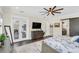 Bright main bedroom boasts hardwood floors, french doors to a balcony, and backyard views at 4001 Ainsley Ave, Orlando, FL 32833