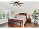 Cozy bedroom with natural light, hardwood flooring, and stylish furnishings at 4001 Ainsley Ave, Orlando, FL 32833