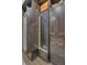 Custom closet design with hidden door opening to dressing room with ample drawers and storage at 4001 Ainsley Ave, Orlando, FL 32833