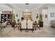 Elegant dining room featuring a large table, stylish chairs, and decorative lighting at 4001 Ainsley Ave, Orlando, FL 32833