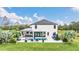 Aerial view of a modern home featuring a backyard oasis with a pool, spa, and entertainment area at 4001 Ainsley Ave, Orlando, FL 32833