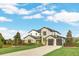 Beautiful two-story house featuring stone and siding exterior, a well-kept lawn, and a spacious driveway at 4001 Ainsley Ave, Orlando, FL 32833