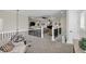 Open hallway with black metal decorative railings overlooking the main floor's Gathering room at 4001 Ainsley Ave, Orlando, FL 32833